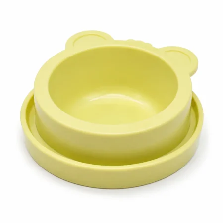 Yellow bear-shaped anti-ant cat feeding bowl on a white background