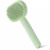 Mint-green cats and dogs grooming slicker brush with fine stainless-steel pins.