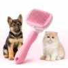 Pink slicker brush with a German Shepherd puppy and Persian kitten.
